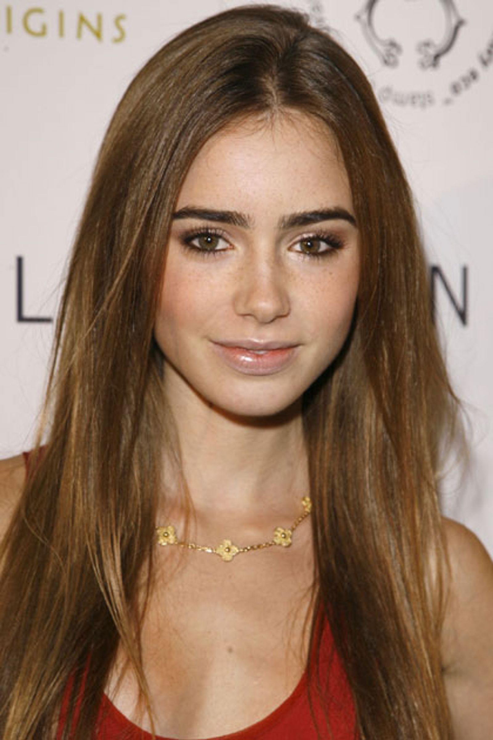 Lily Collins' Beauty Look: Bob Haircut, Bushy Brows, And Nude Lips Lily Collins' Beauty Look: Bob Haircut, Bushy Brows, And Nude Lips