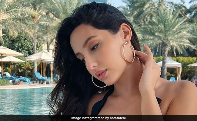 Nora Fatehi's Stunning Red Bikini Beach Photos Nora Fatehi's Stunning Red Bikini Beach Photos
